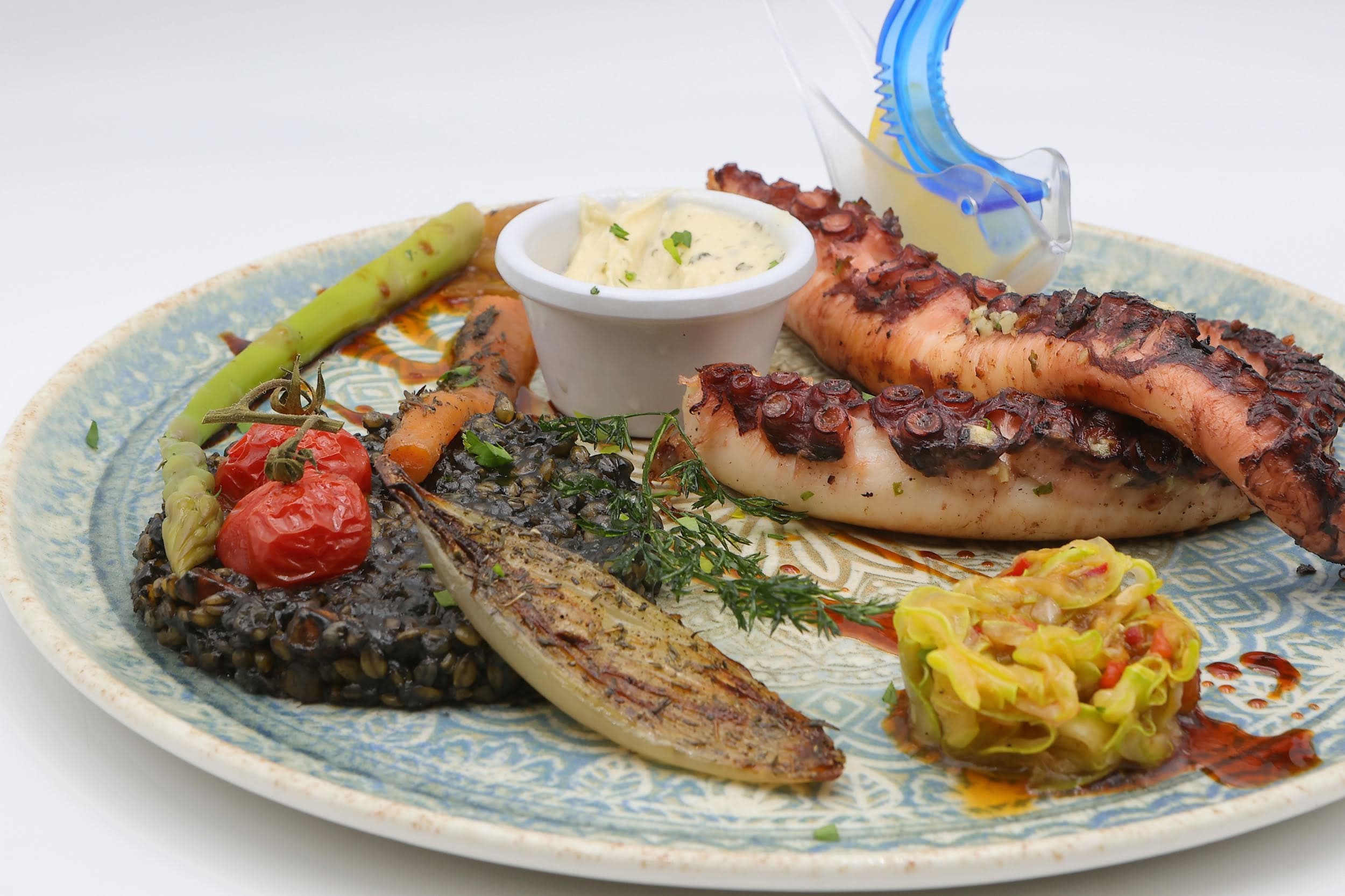 Grilled octopus, black polenta