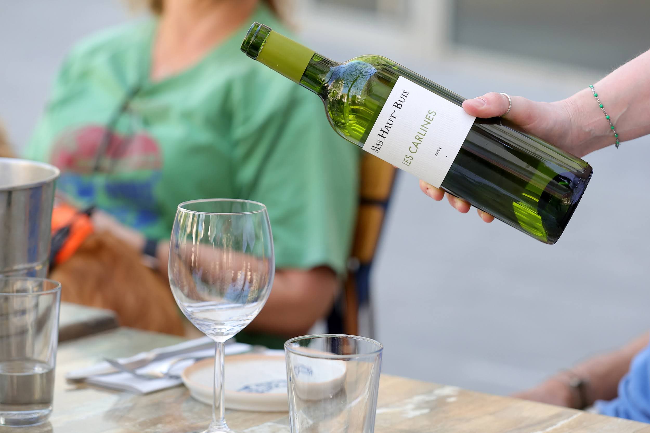 Pouring white wine on the terrace